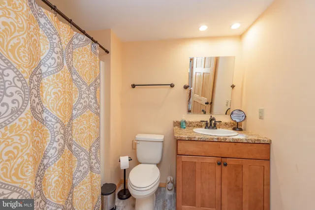 a view of a backyard with a garden and trees