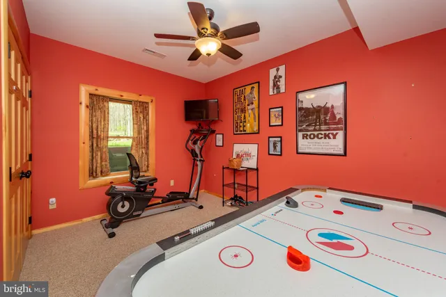 an aerial view of a house having yard table and chairs