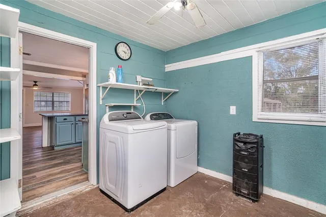 a view of storage and utility room with washer and dryer