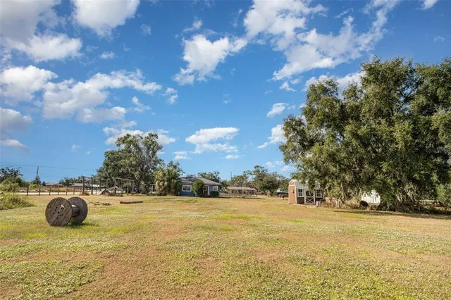 a view of swimming pool of water with outdoor seating