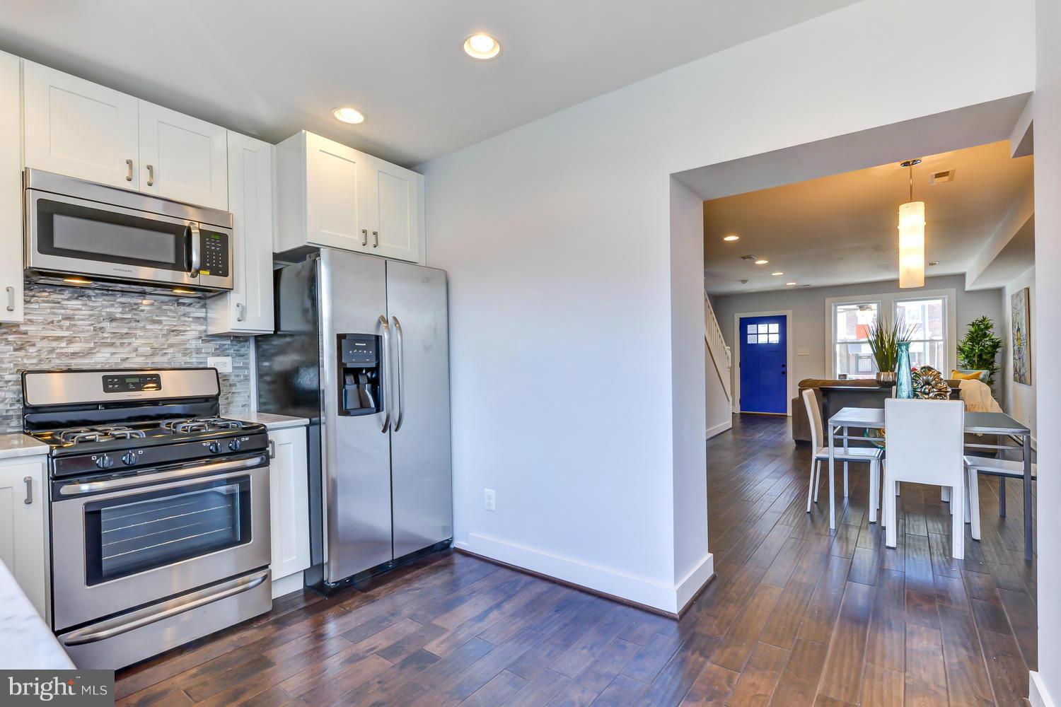 556 24th Street Northeast Washington, DC 20002 - Photo 9 of 30 Renovated Kitchen with White Cabinets & Stainless