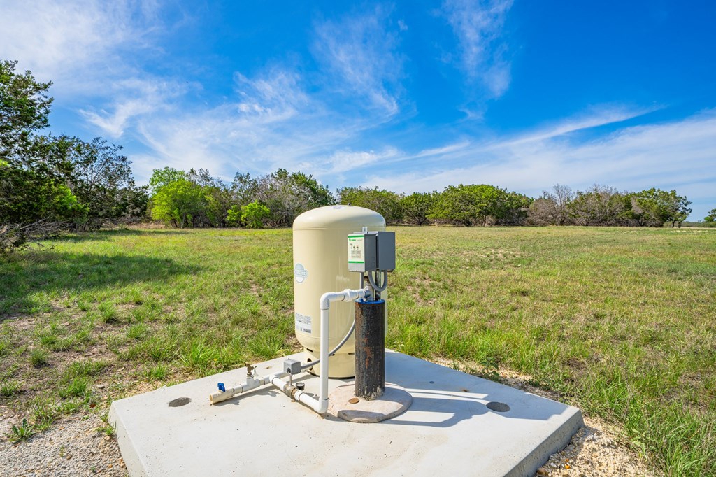 185 Coldwater Dr Center Point Kerrville, TX 78028 - Photo 9 of 15 a view of a garden with a bench in the background