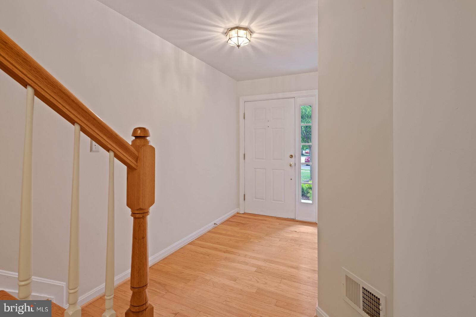 47742 Warwickshire Terrace Sterling, VA 20165 - Photo 7 of 88 Hardwood Floors in Foyer & on Stairs