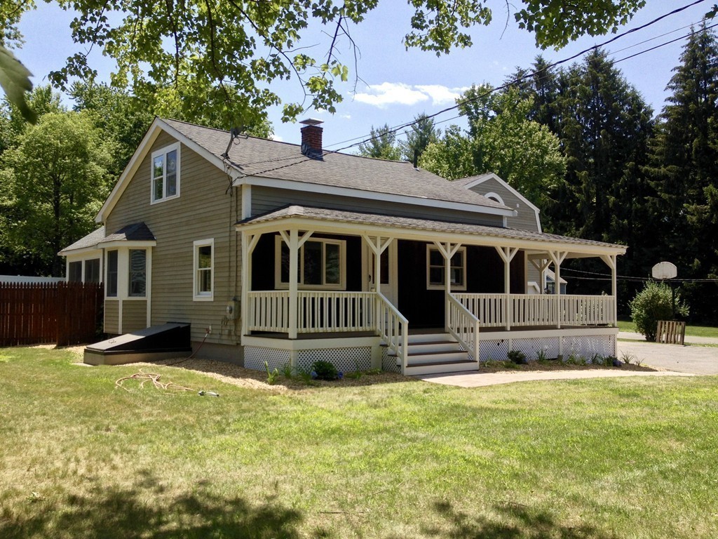96 Whalom Road Lunenburg, MA 01462 - Photo 9 of 20 a front view of a house with a yard