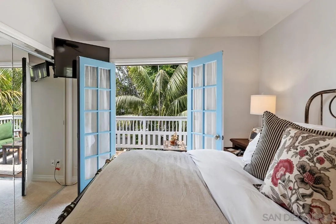 828 Bluewater Road Carlsbad, CA 92011 - Photo 17 of 36 a bedroom with a bed and a large window