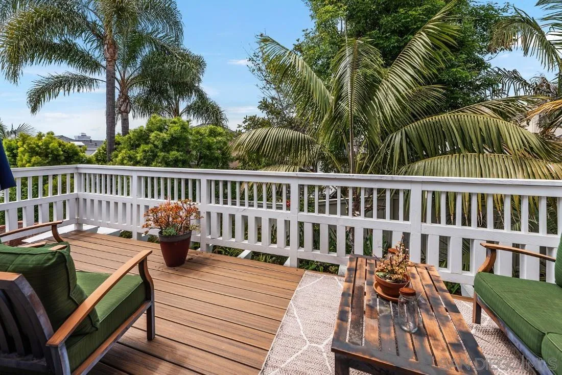 828 Bluewater Road Carlsbad, CA 92011 - Photo 18 of 36 a view of a chair and tables on the deck