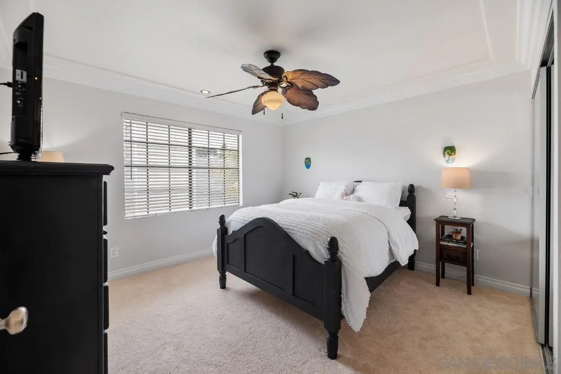 828 Bluewater Road Carlsbad, CA 92011 - Photo 24 of 36 a spacious bedroom with a bed and a window