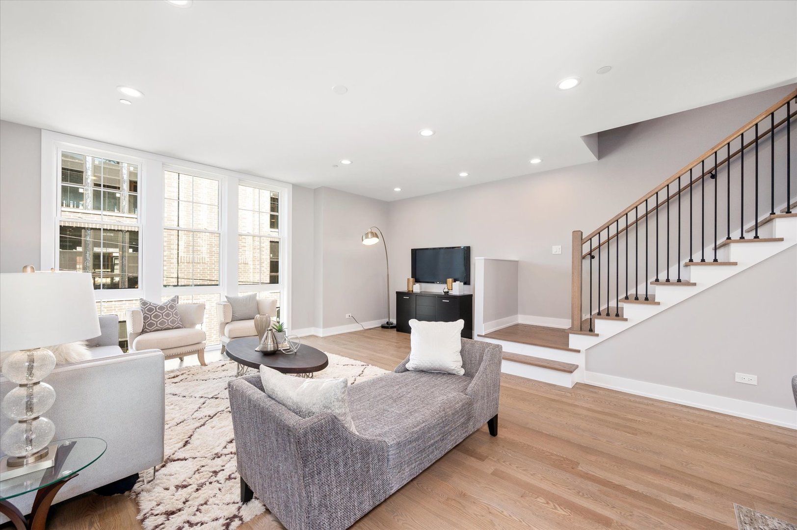 4438 South Drexel Boulevard, Unit D Chicago, IL 60653 - Photo 14 of 29 a living room with furniture wooden floor and a large window