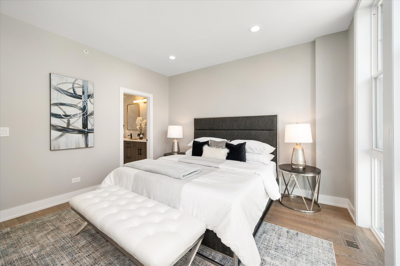 4438 South Drexel Boulevard, Unit D Chicago, IL 60653 - Photo 19 of 29 a bedroom with a bed and wooden floor