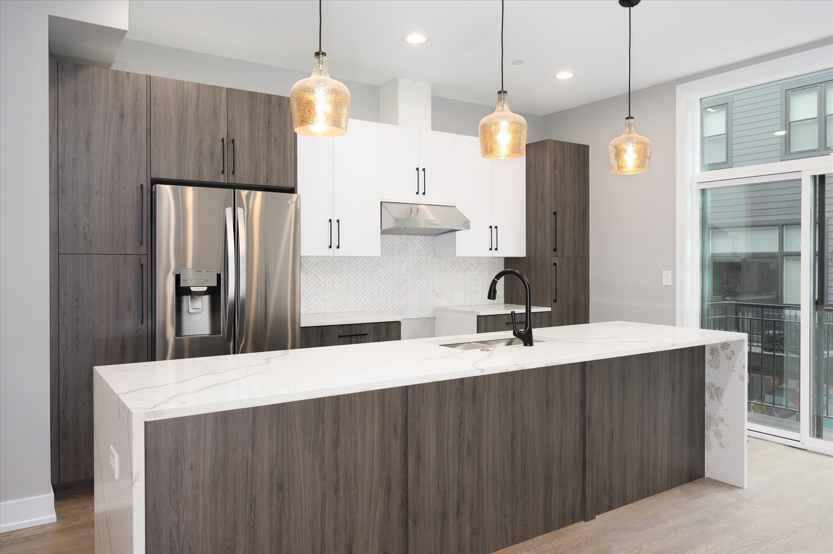 4438 South Drexel Boulevard, Unit D Chicago, IL 60653 - Photo 2 of 29 a kitchen with stainless steel appliances a dining table a sink and wooden floor
