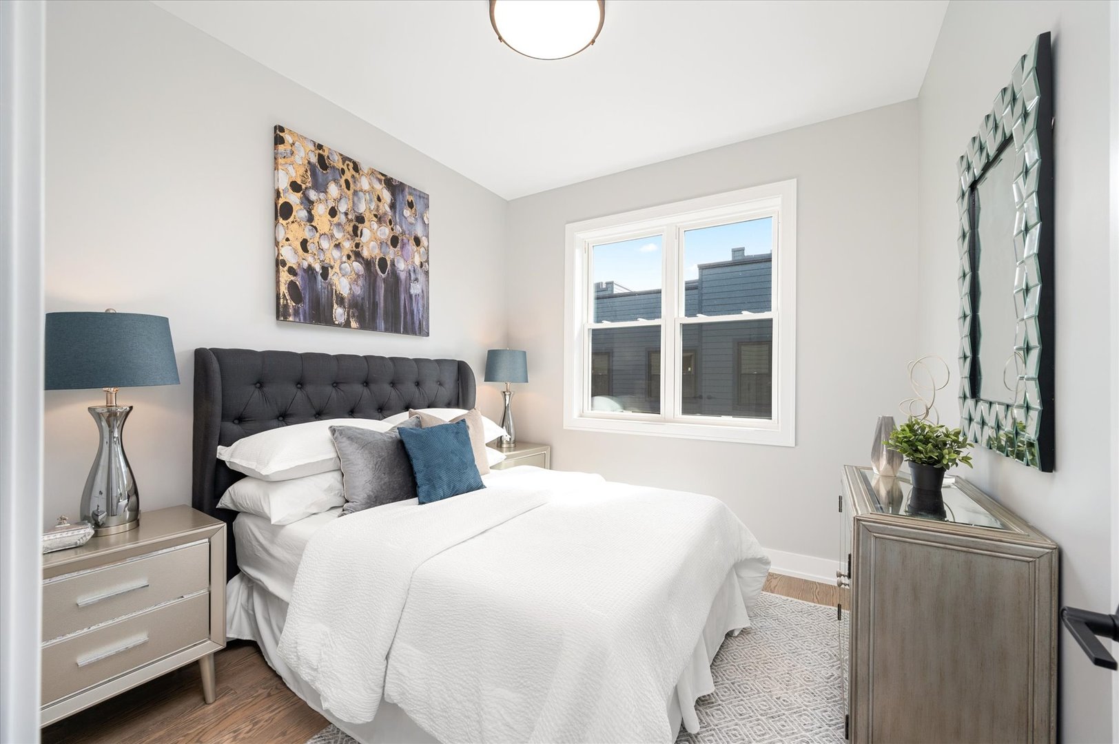 4438 South Drexel Boulevard, Unit D Chicago, IL 60653 - Photo 24 of 29 a bedroom with a large bed and a window
