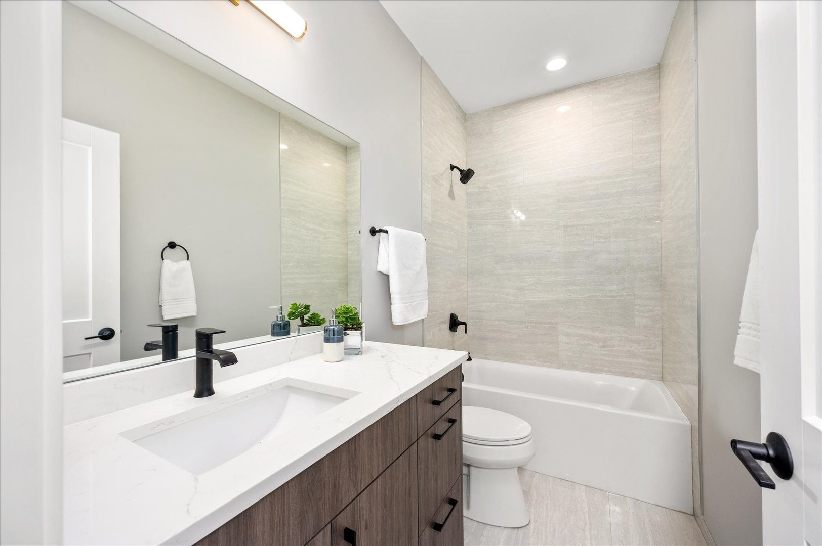 4438 South Drexel Boulevard, Unit D Chicago, IL 60653 - Photo 25 of 29 a bathroom with a sink a toilet and a large mirror