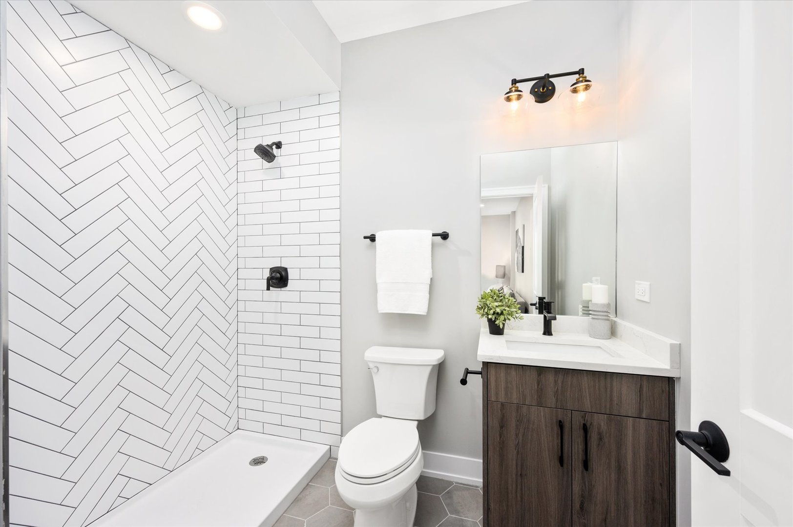 4438 South Drexel Boulevard, Unit D Chicago, IL 60653 - Photo 8 of 29 a bathroom with a sink a toilet and shower