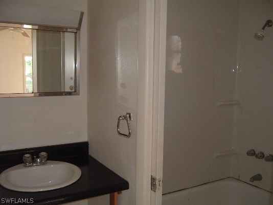 3255 Stringfellow Road St. James City, FL 33956 - Photo 13 of 16 a bathroom with a sink and a mirror