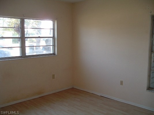 3255 Stringfellow Road St. James City, FL 33956 - Photo 15 of 16 an empty room with a window