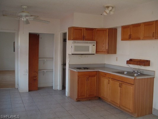 3255 Stringfellow Road St. James City, FL 33956 - Photo 8 of 16 a kitchen with stainless steel appliances granite countertop a sink stove and refrigerator