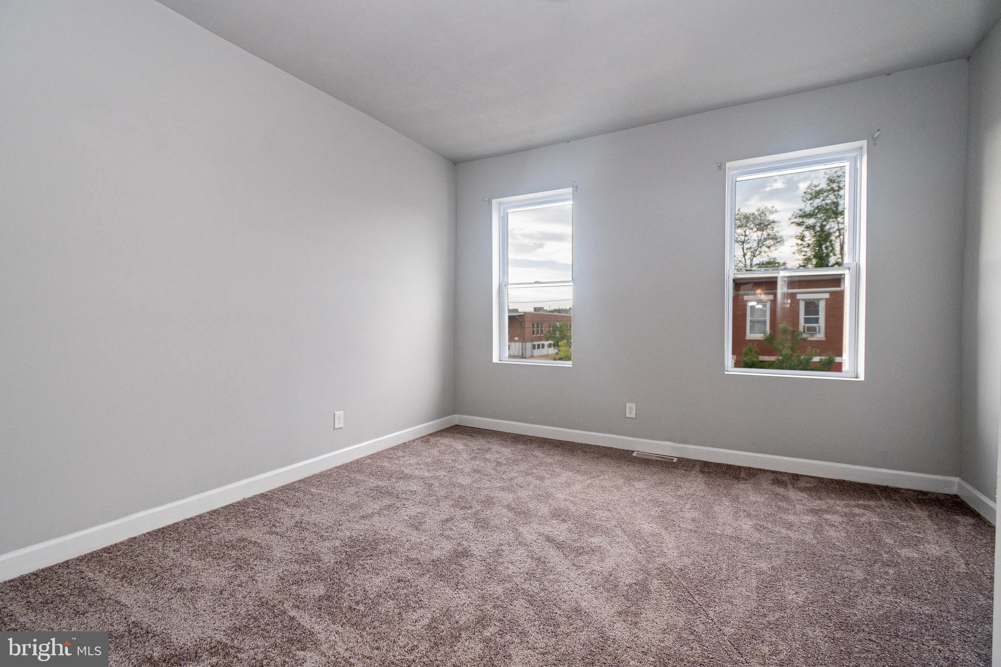 3103 East Monument Street Baltimore, MD 21205 - Photo 15 of 20 an empty room with windows