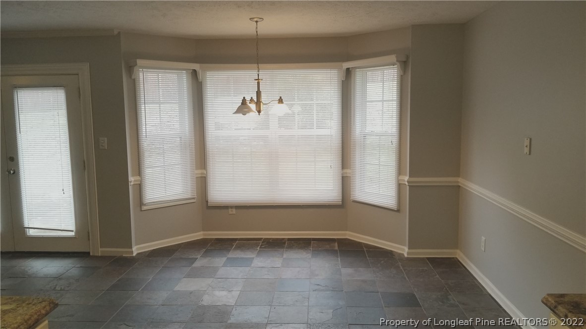 5812 Spreading Branch Road Hope Mills, NC 28348 - Photo 12 of 38 an empty room with windows