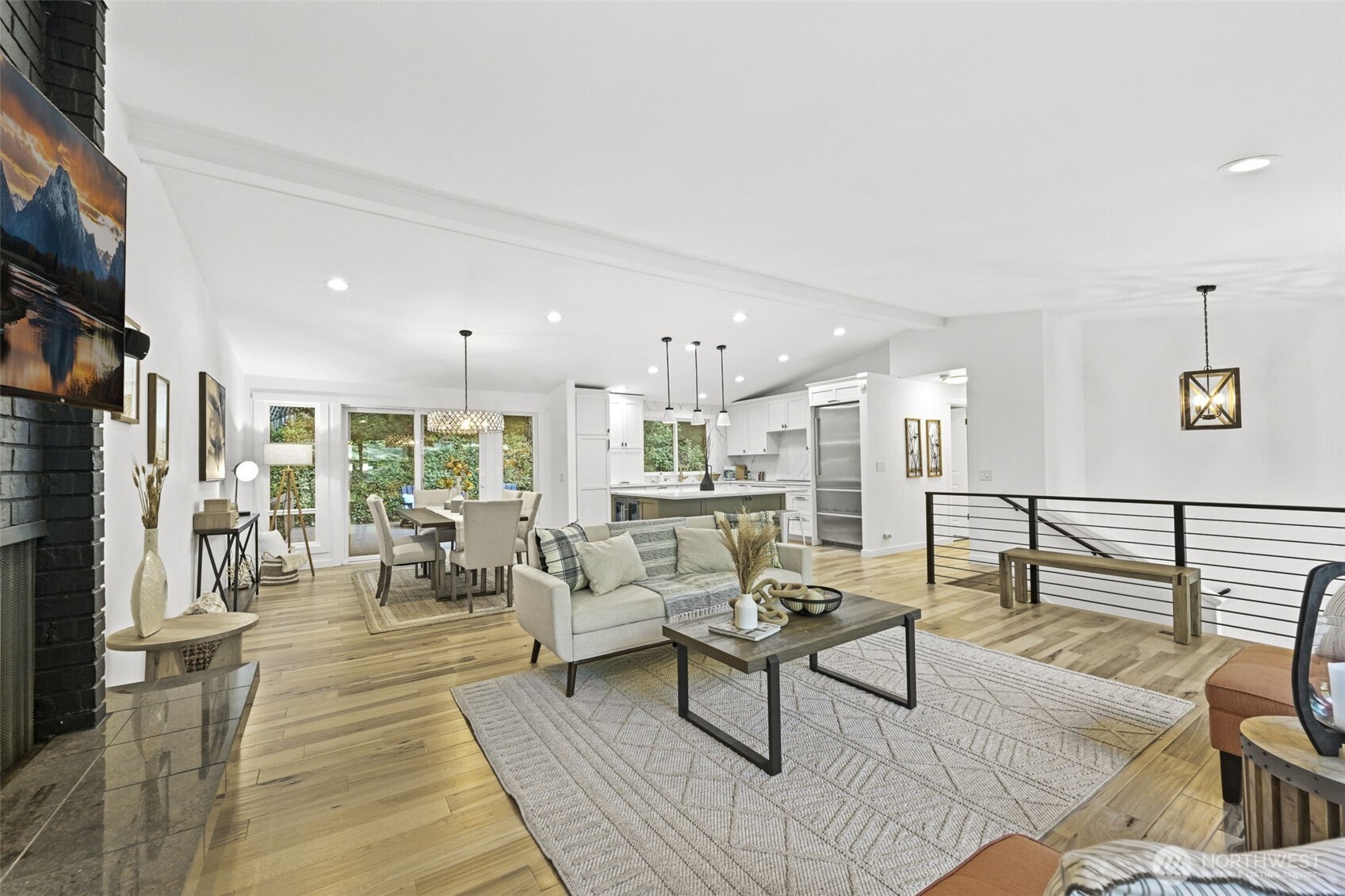 a living room with furniture wooden floor and a flat screen tv