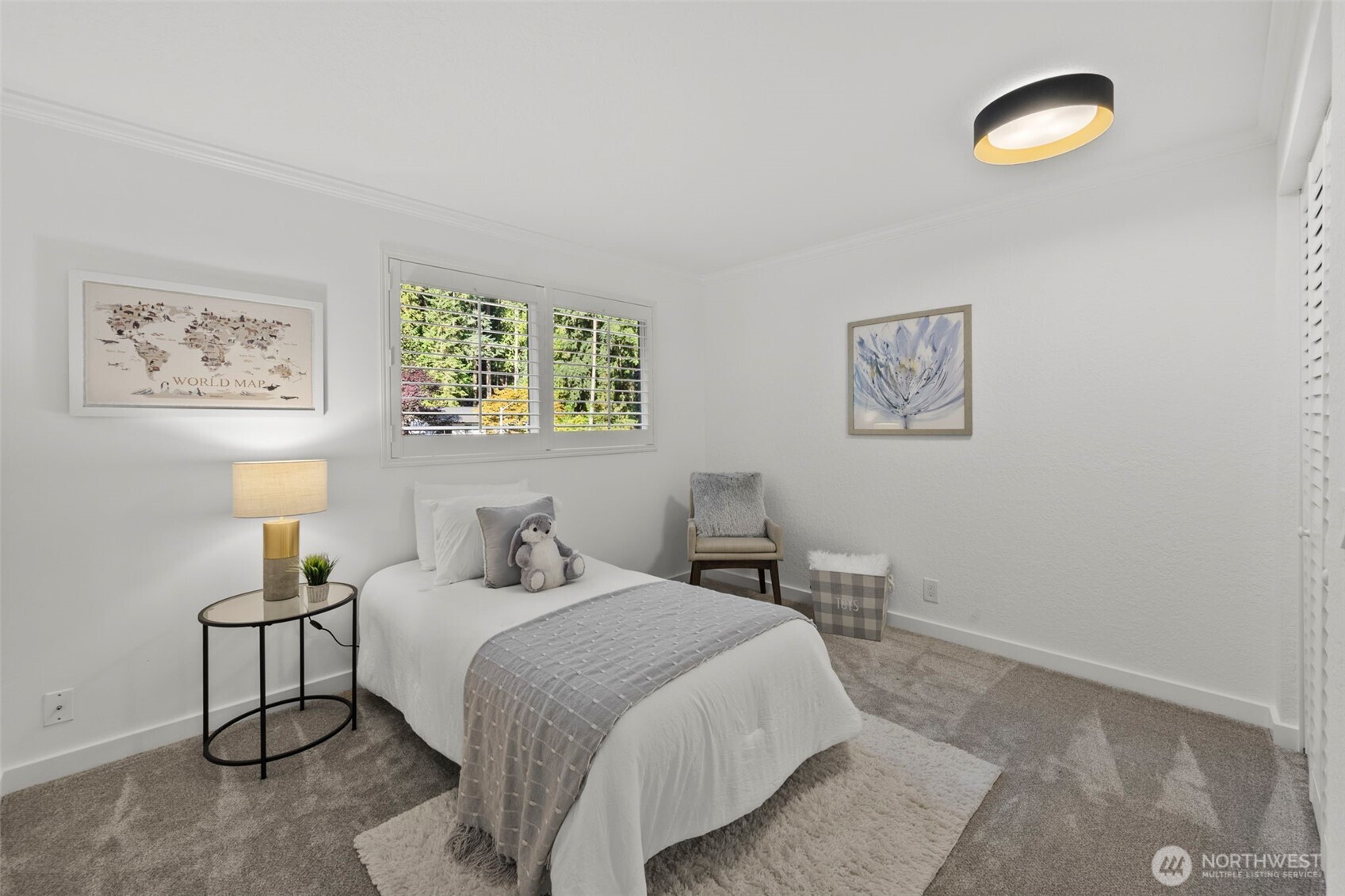 20911 30th Drive Southeast Bothell, WA 98021 - Photo 16 of 40 a bedroom with a bed and a painting on the wall