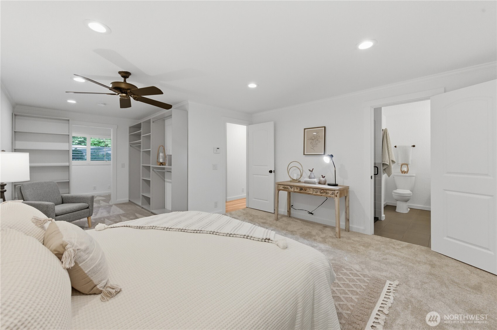 20911 30th Drive Southeast Bothell, WA 98021 - Photo 19 of 40 a bedroom with a bed and a chandelier