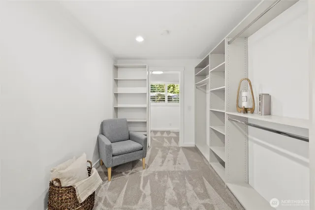 a living room with furniture and white walls