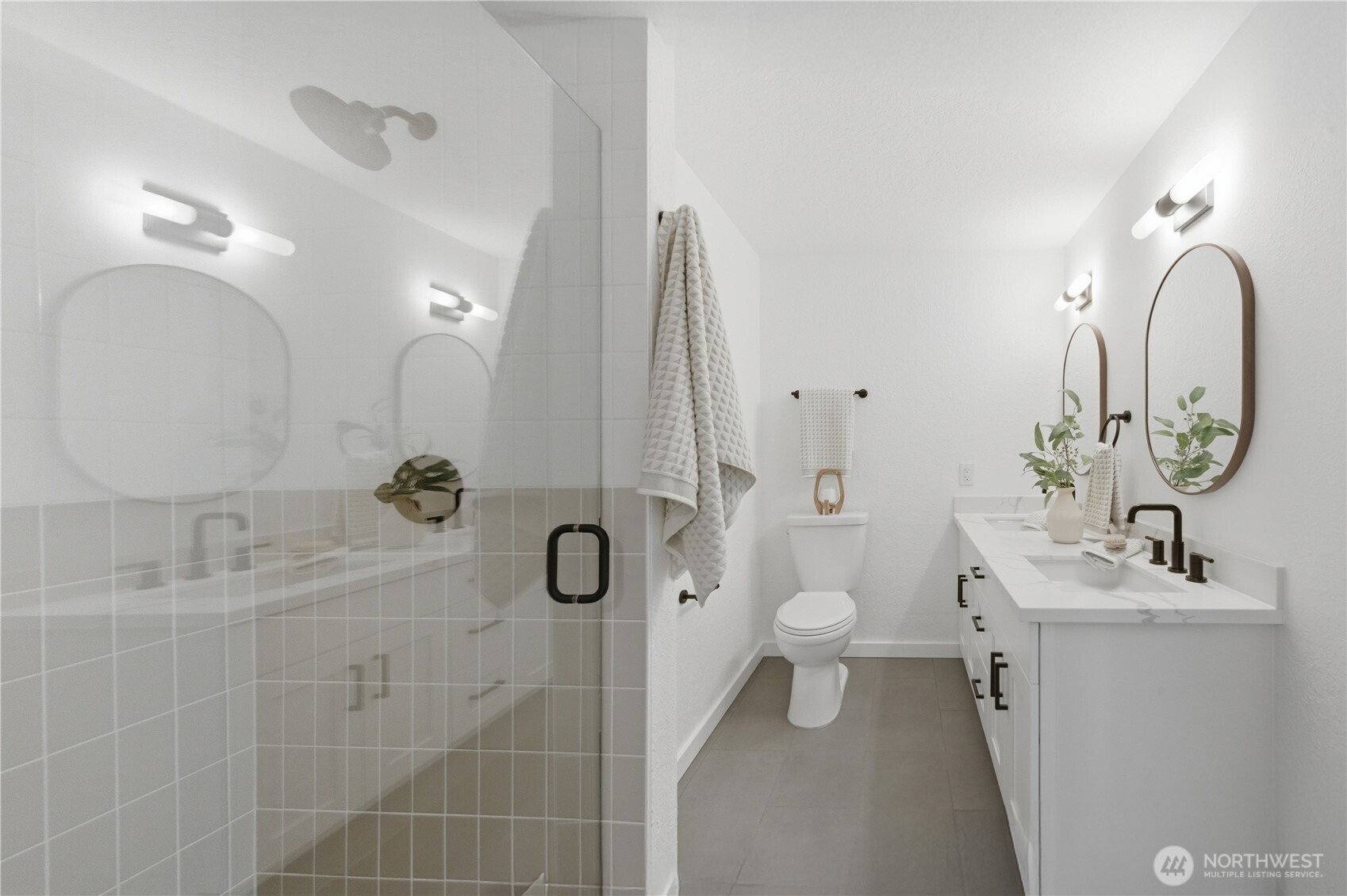 20911 30th Drive Southeast Bothell, WA 98021 - Photo 23 of 40 a bathroom with a sink a toilet and a mirror