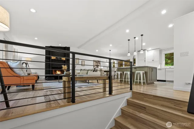a view of a living room and entry way to other room