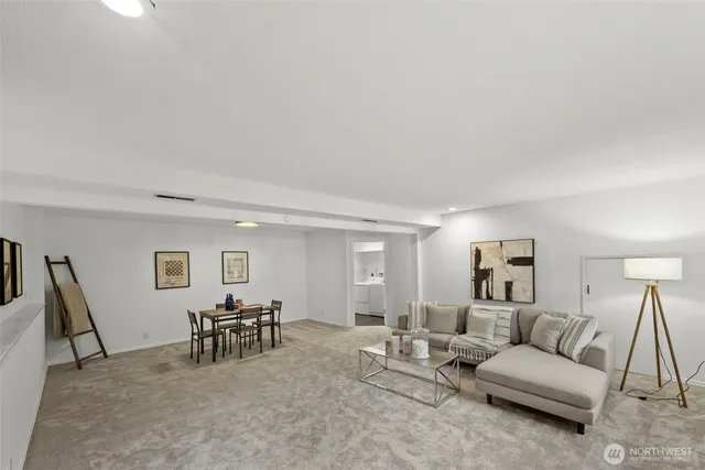 a living room with furniture and a table