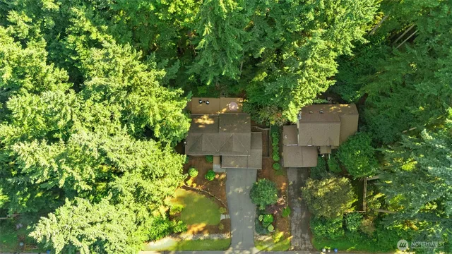 an aerial view of a house with a yard and garden