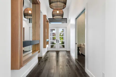 a view of a hallway view with wooden floor and staircase