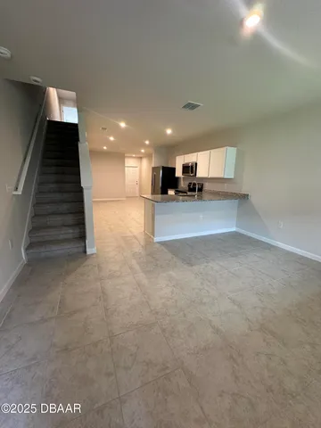 a view of a kitchen with a sink