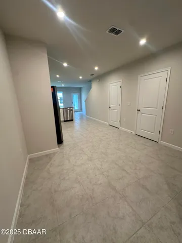 a view of a hallway with stairs