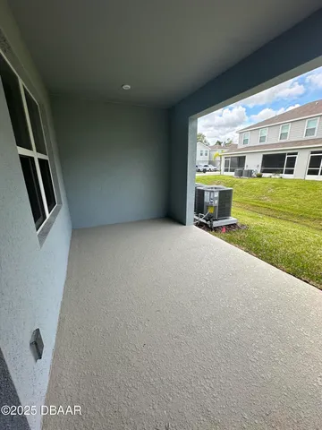 a view of an empty room with a fireplace