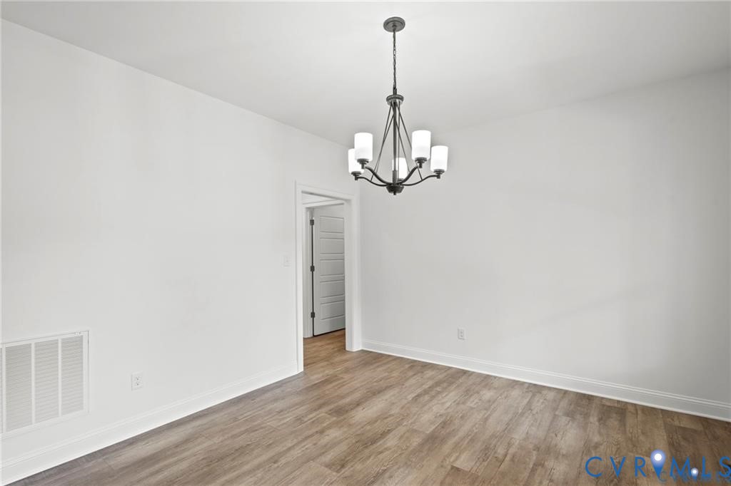 4927 Gooden Trail Quinton, VA 23141 - Photo 19 of 22 a view of a chandelier in hallway with a chandelier