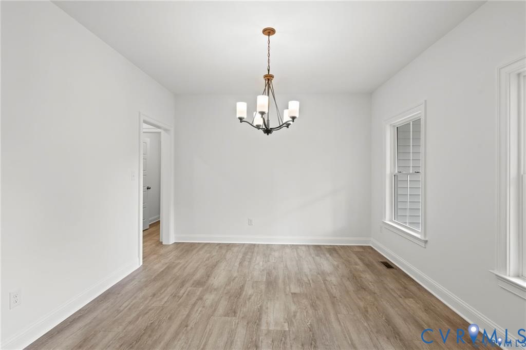 4927 Gooden Trail Quinton, VA 23141 - Photo 8 of 22 wooden floor in an empty room with a window