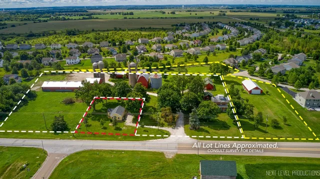 an aerial view of residential house with outdoor space and swimming pool