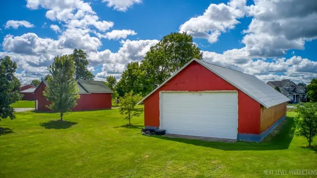 a view of a house with a yard and plants