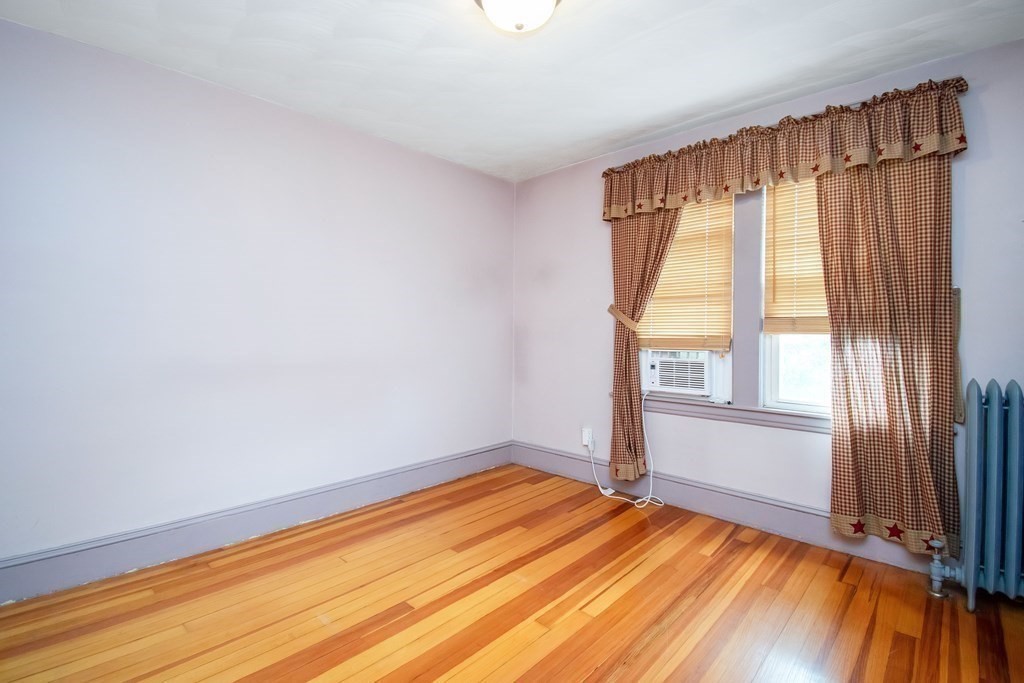 151 Rimmon Avenue Chicopee, MA 01013 - Photo 16 of 39 a view of empty room with wooden floor and fan