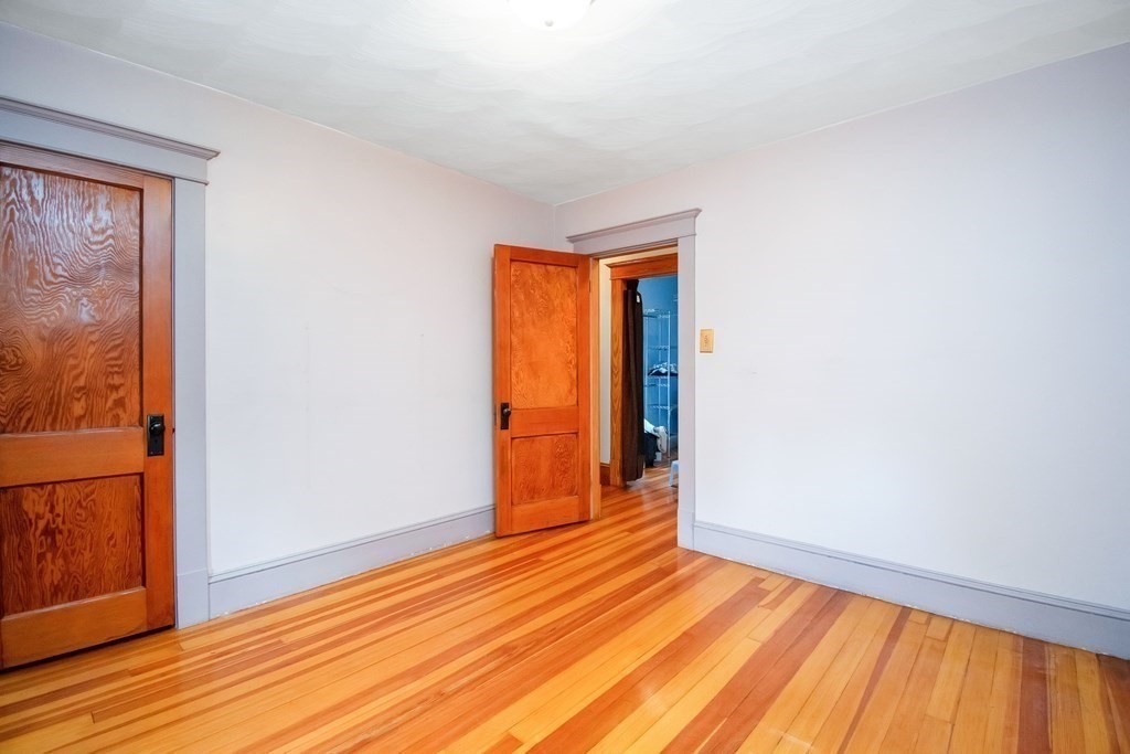 151 Rimmon Avenue Chicopee, MA 01013 - Photo 18 of 39 a view of an empty room with wooden floor and a window