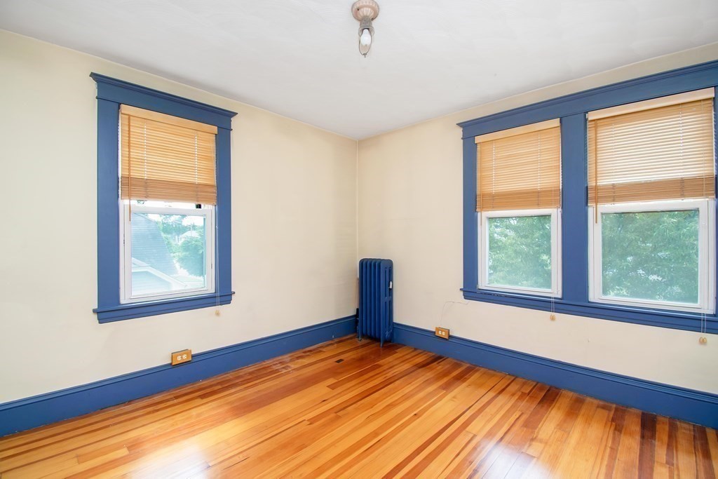 151 Rimmon Avenue Chicopee, MA 01013 - Photo 23 of 39 a view of an empty room with wooden floor and a window