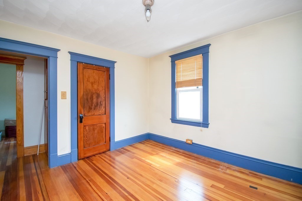 151 Rimmon Avenue Chicopee, MA 01013 - Photo 25 of 39 a view of an empty room with wooden floor and a window