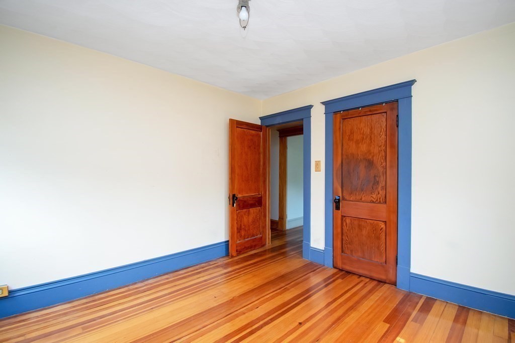 151 Rimmon Avenue Chicopee, MA 01013 - Photo 26 of 39 a view of an empty room with wooden floor