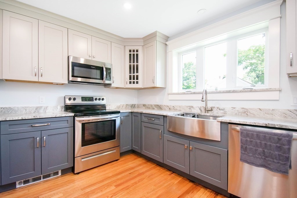 151 Rimmon Avenue Chicopee, MA 01013 - Photo 4 of 39 a kitchen with stainless steel appliances granite countertop a sink and a stove