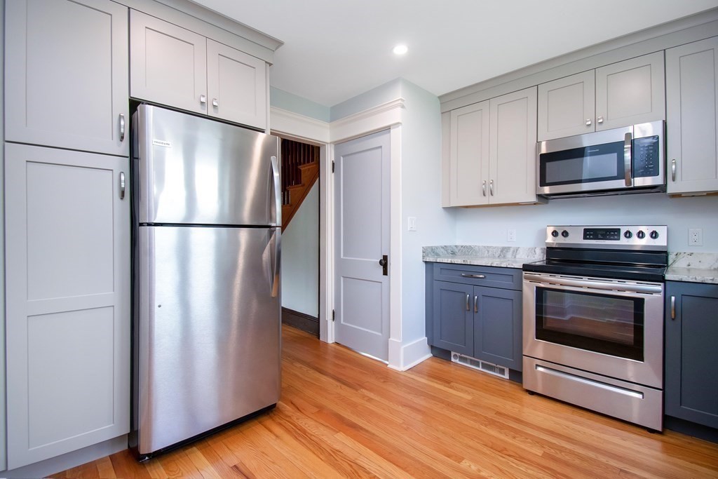 151 Rimmon Avenue Chicopee, MA 01013 - Photo 5 of 39 a kitchen with stainless steel appliances granite countertop a refrigerator stove a sink and a microwave