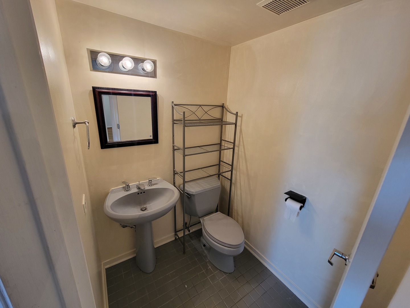 6337 Roosevelt Road, Unit 417 Berwyn, IL 60402 - Photo 25 of 37 a bathroom with a toilet sink and mirror