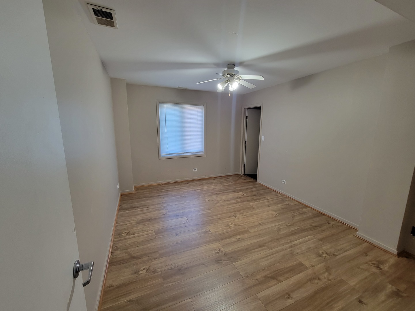 6337 Roosevelt Road, Unit 417 Berwyn, IL 60402 - Photo 27 of 37 wooden floor in an empty room with a window
