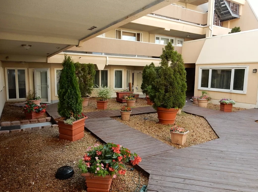 6337 Roosevelt Road, Unit 417 Berwyn, IL 60402 - Photo 3 of 37 a view of a house with patio furniture and potted plants