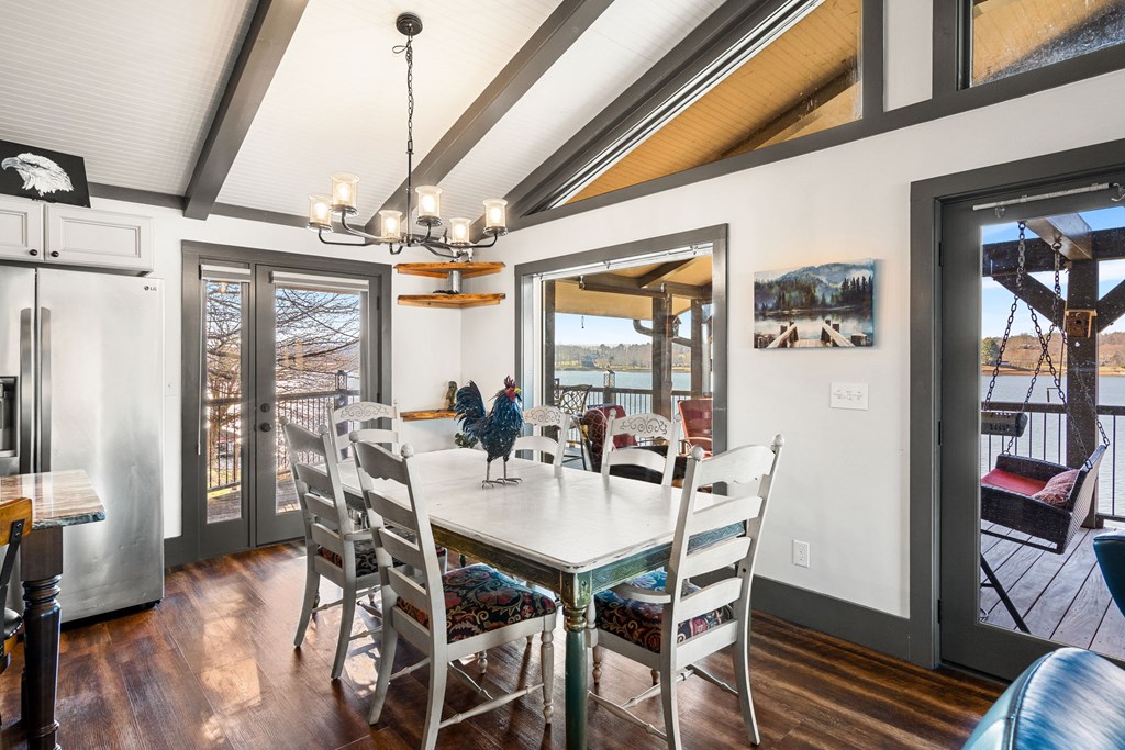 314 Kilpatrick Point Drive Hayesville, NC 28904 - Photo 13 of 50 a view of a dining room with furniture large window and wooden floor