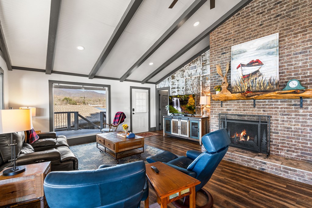 314 Kilpatrick Point Drive Hayesville, NC 28904 - Photo 17 of 50 a living room with furniture fireplace and a large window